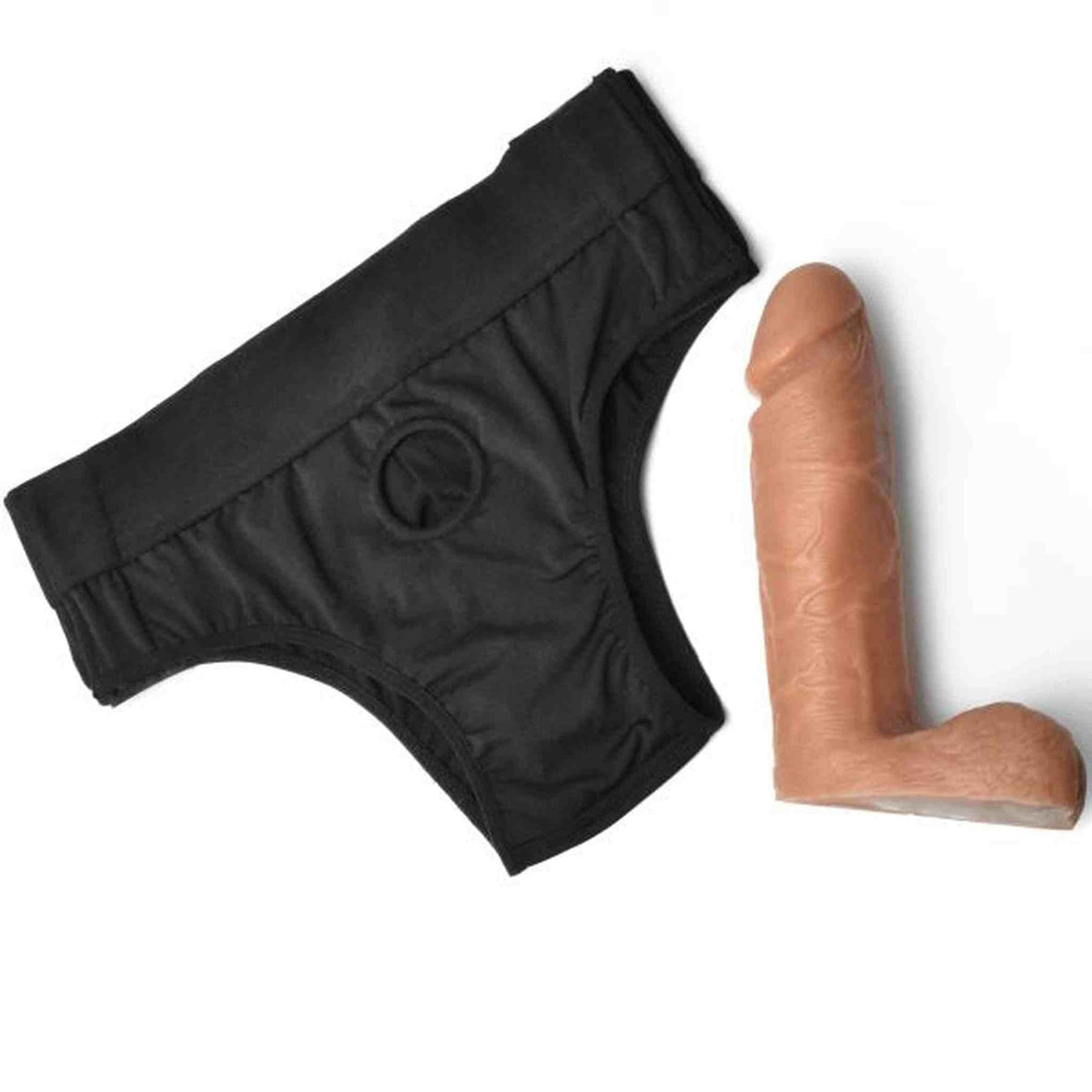 Sleeve per pene marrone chiaro posizionato vicino a mutande nere elastiche