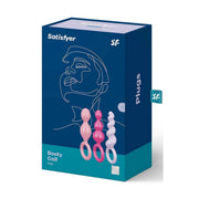 Confezione scatola Satisfyer Booty Call Plugs colorata con etichetta body safe, mostra tre plug pastello da 15 cm