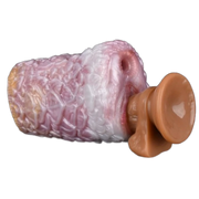 Dildo in silicone liquido rosa bianco arancione con texture a petali e base ventosa
