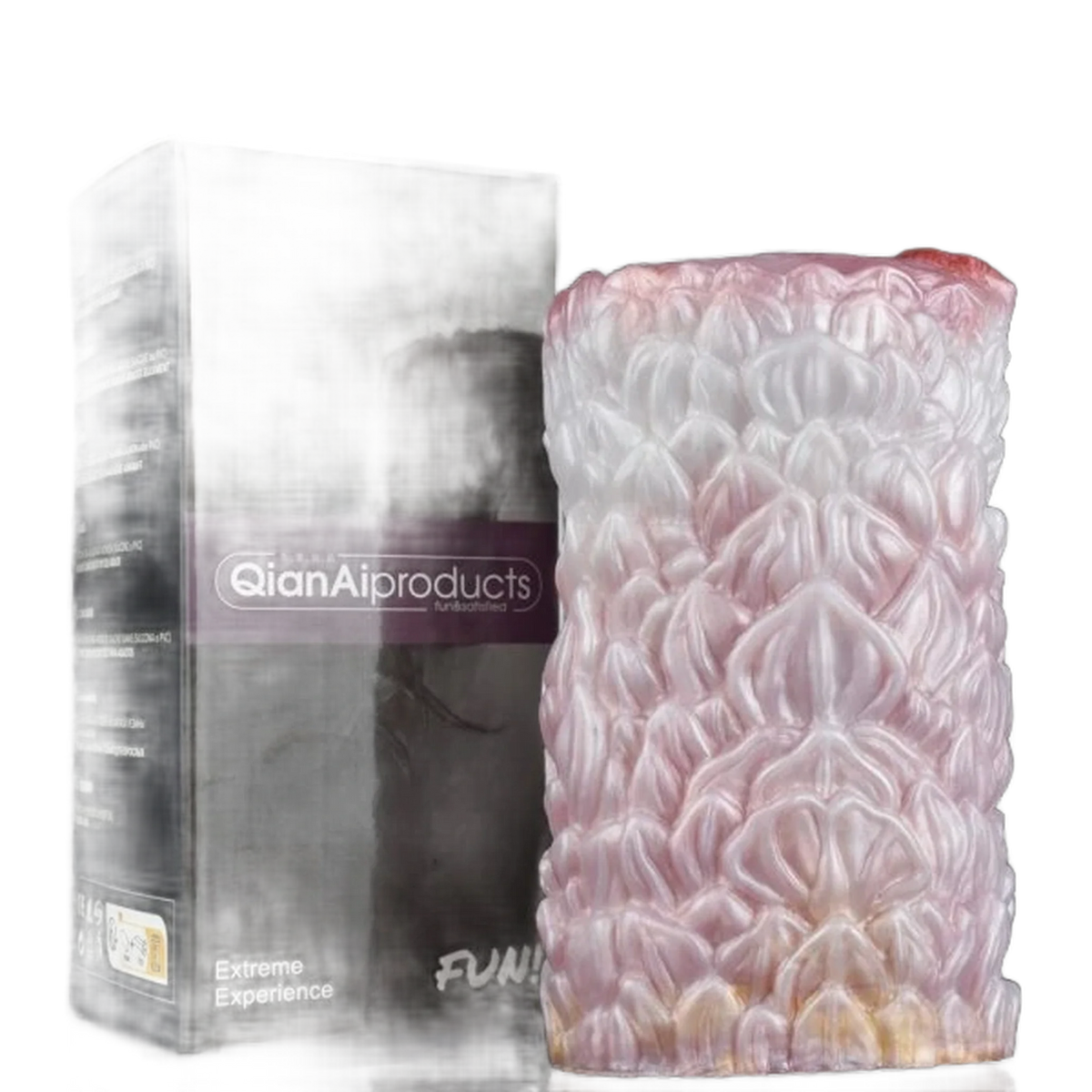 Dildo Camellia in silicone liquido accanto alla confezione Extreme Experience viola