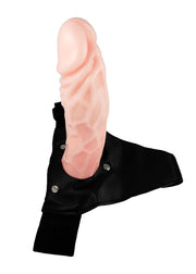 Vista laterale strap-on in silicone rosa chiaro con tre bottoni metallici