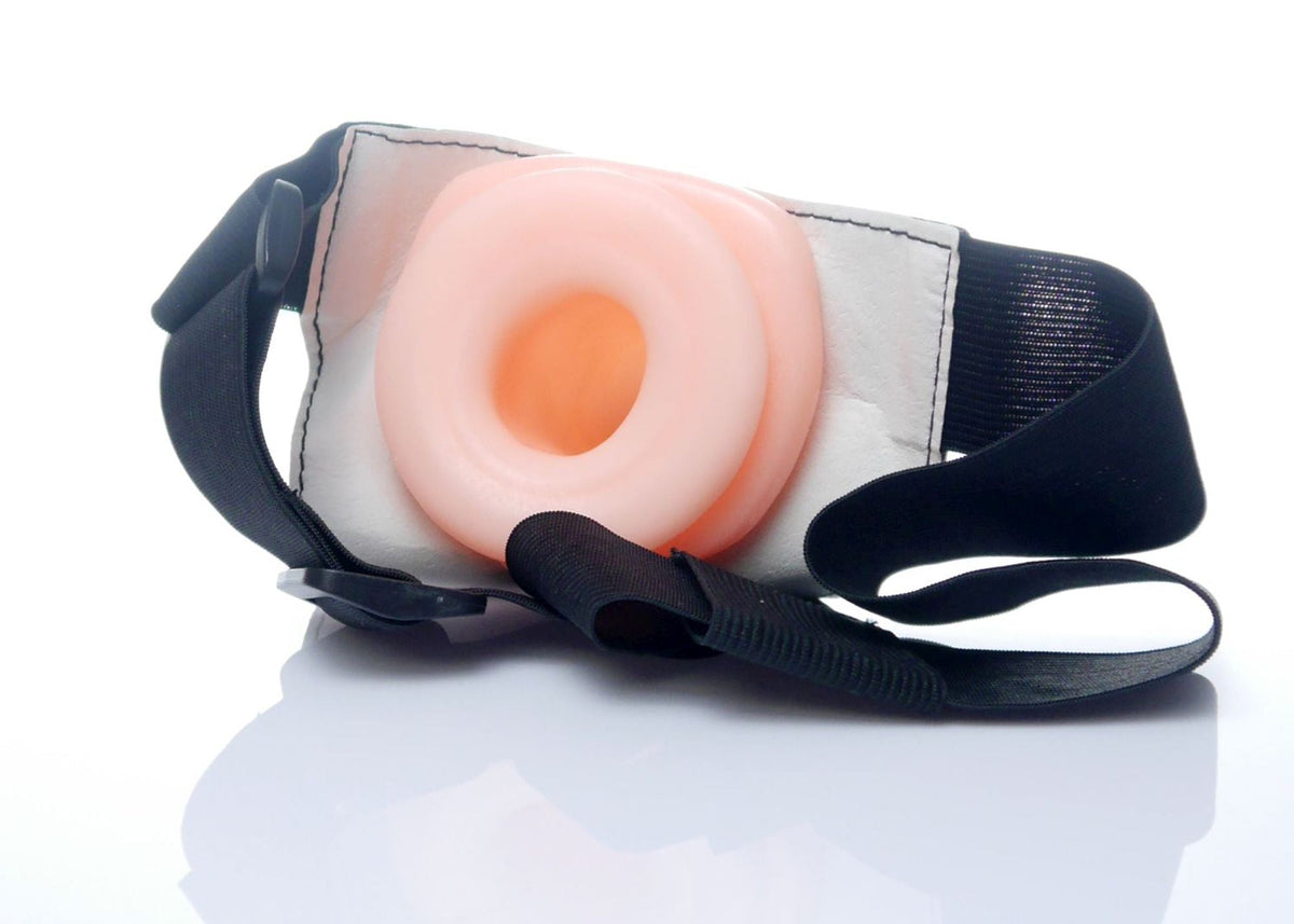 Anello penile in silicone rosa chiaro con apertura centrale e base bianca