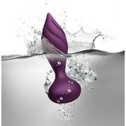 Plug anale Desire viola impermeabile a spirale immerso nell'acqua con spruzzi