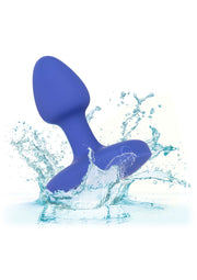 Plug anale impermeabile in silicone blu immerso nell'acqua con spruzzi