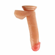 Dildo rosa carne curvo con ventosa e testicoli, vista angolare