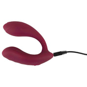 Vibratore flessibile colore bordeaux in carica con cavo nero
