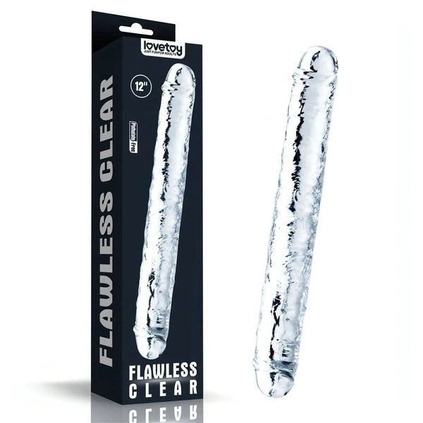 Dildo trasparente Lovetoy accanto alla confezione nera da 12 pollici