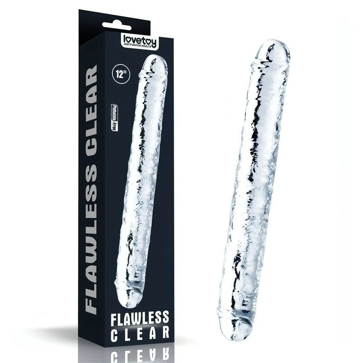 Dildo trasparente Lovetoy accanto alla confezione nera da 12 pollici