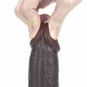 Flessibilità dildo TPE nero scuro con pressione su glande retrattile