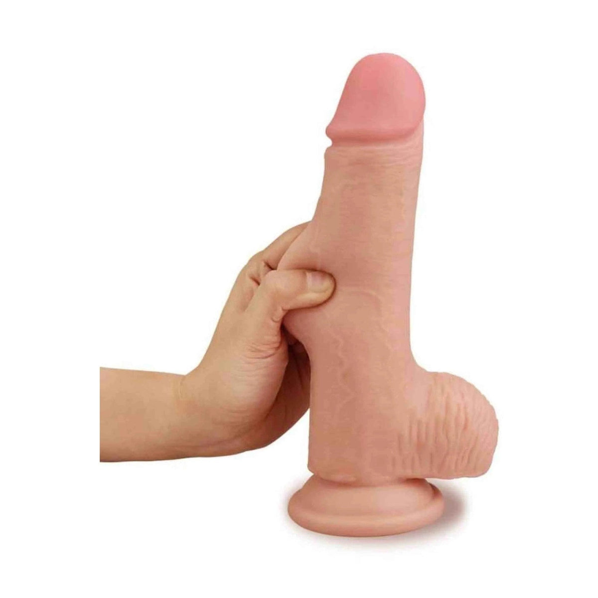 Dildo realistico Lovetoy compresso per mostrare texture pelle e dual density