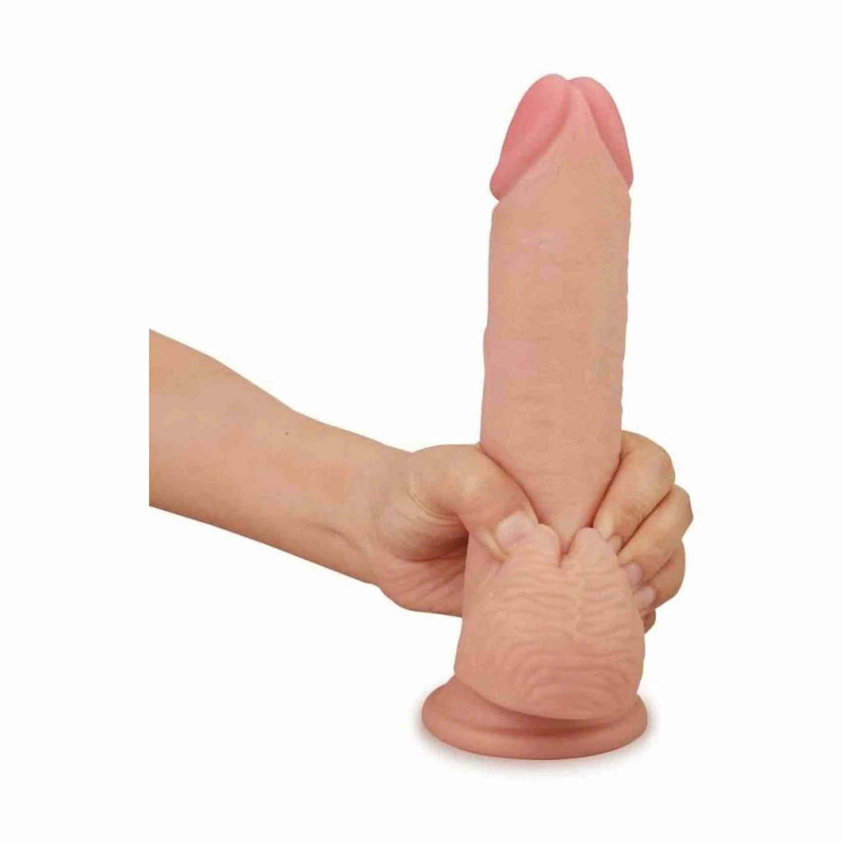 Dildo flessibile Lovetoy piegato a mano per dimostrare morbidezza