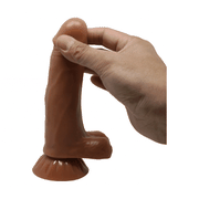 Dildo vibrante mulatto TPE liscio tenuto in mano con base a ventosa