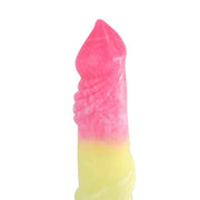 Profilo laterale dildo rosa giallo superficie lucida
