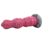 Dildo rosa orizzontale punta appuntita superficie a spirale e base roccia