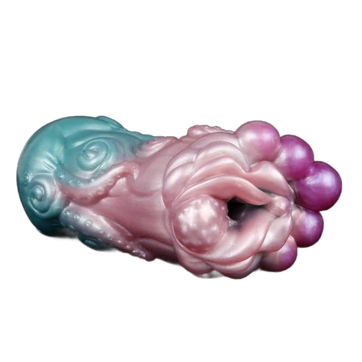 Toy in silicone liquido bicolore turchese e rosa con dettagli tentacoli, texture floreale e sfere viola