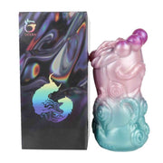 Toy in silicone liquido GEEBA con finitura iridescente rosa e turchese, confezione nera