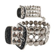 Vista laterale manette eleganti Noir Argent Elegant Os con dischi metallici e chiusura decorata