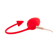 Ovetto vibrante rosso in silicone con cavo di ricarica beige inserito