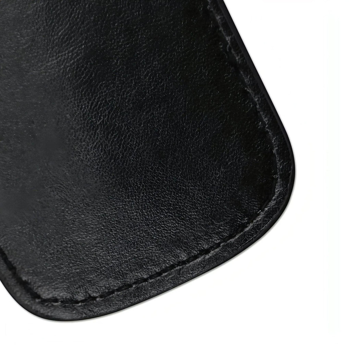 Dettaglio superficie nera granulosa di paddle BDSM con cuciture precise