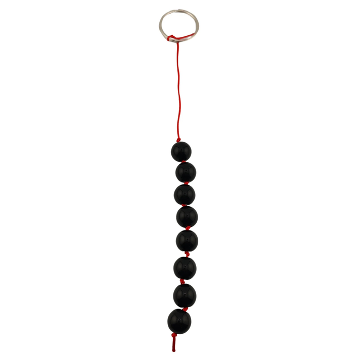 Vista frontale palline anali nere compatte con anello metallico