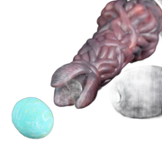 Ovipositor Pandora organico rosso-marrone con uovo turchese e pezzo grigio