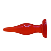 Plug anale rosso design affusolato con incisioni decorative e base arrotondata