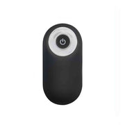 Telecomando wireless ovale nero per stimolatore prostatico con anello bianco e pulsante accensione