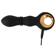 Vibratore nero in silicone con anello dorato collegato al cavo di ricarica