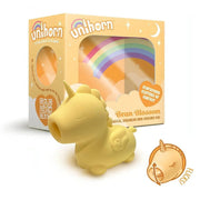 Vibratore clitorideo Unihorn Bean Blossom unicorno giallo profilo laterale con scatola imballaggio alle spalle