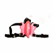 Vibratore a forma di farfalla rosa con cinghie nere e fibbie metalliche