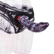 Dildo animale in silicone viola montato su supporto nero con pizzo